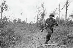 Soldiers Running Through Area