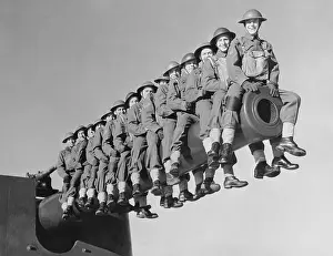 Soldiers Sitting on Canon