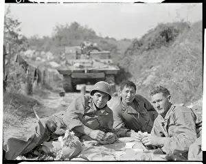 Soldiers Sitting on Ground