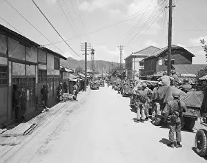 Utility Pole Prints: Soldiers Stopping in a Street