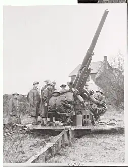 Soldiers Surrounding Military Gun