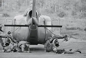 Special Forces Prints: Soldiers Taking Refuge Under Helicopter
