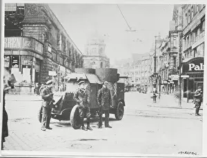 Soldiers and Vehicle in Center of Street