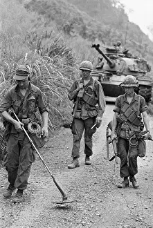 Soldiers Walking and Checking for Buried Mines