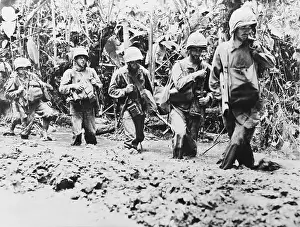 Trail Prints: Soldiers Walking Through Jungle Mud