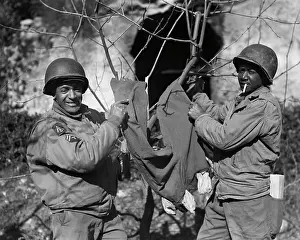 Two Soldiers Washing Clothes