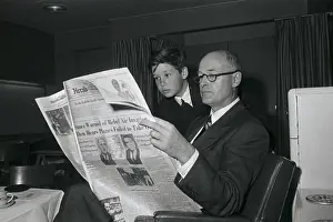 Kennan Prints: Son Reading Newspaper over George Kennan's Shoulder