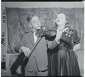 Songstress and Violinist Rehearsing