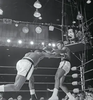 Sonny Liston Punching Cassius Clay in Ribs