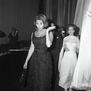 Prints of Oscar-winning actor Sophia Loren animatedly talks with a friend after appearing on the stage of Festival Hall during the opening ceremonies of the 15th International Cannes Film Festival The enduring elegance and charisma of Sophia Loren: Sophia Loren Attends Cannes Film Festival