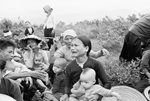 Villager Prints: South Vietnamese Villagers Wait for Evacuation During Vietnam War