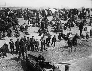 Prints of circa 1895: A crowded Southsea beach. Boys watch some youths launch a rowing boat. (Photo by F J Mortimer/Getty Images) Francis James Mortimer (1874-1944) Prints: Southsea Beach