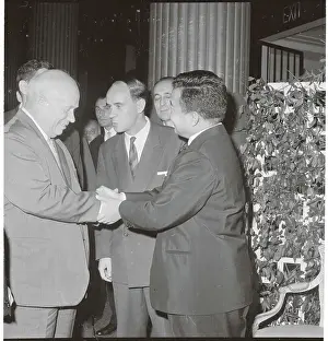 Soviet and Cambodian Leaders Joining Hands While Conversing