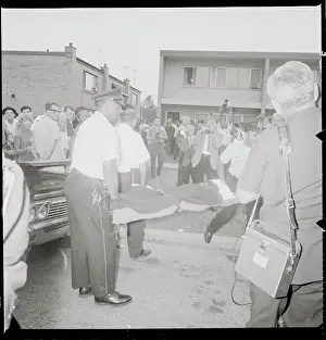 Speck Victim Being Carried to Morgue as Crowd Watches