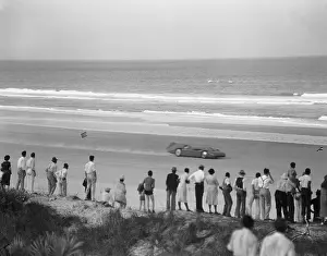 Spectators Watching Race Car