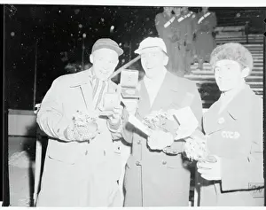 Speed Skating Winners Showing Their Medals