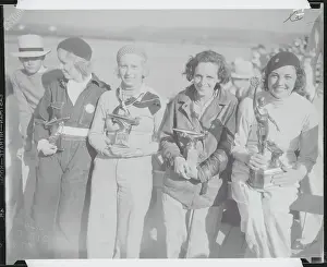 Speedboat Racers Posing with Their Trophies