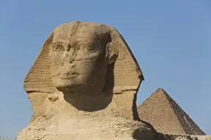 Sphinx (foreground), Pyramid of Mycerinus (background), The Giza Pyramids