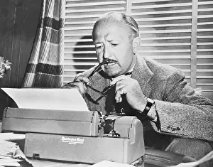 Sports Columnist Dan Parker Working at Typewriter
