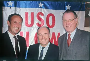 Sports Executives in Front on Flag
