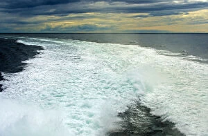 Spray in a ship wake at sea, at sunset, North Sea