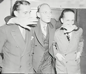 Spy Suspects Embracing at Courthouse