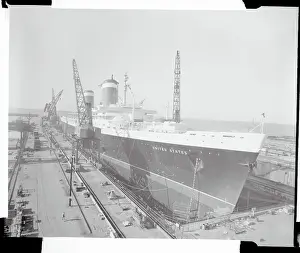 The S.S. United States Sitting at a Building Dock