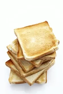 Stacked slices of toast, toasted slices of bread
