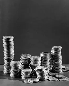 Greed Prints: Stacks of Tarnished Silver Dollars