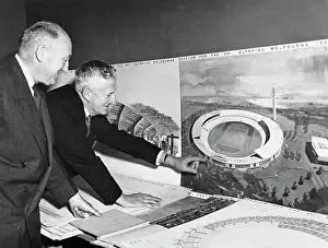 Prints of Arthur W Coles (left), chair of the Melbourne Olympic Games Committee, and WS Kent Hughes, Minister for the Interior, examine the winning design by architect Frank Heath for the 1956 Olympic stadium Bettmann Archive Prints: Stadium Design For Melbourne Olympics