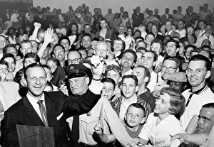 Stan Musial Holds Up Ball For Fans
