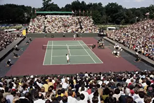 Prints of General view of American tennis player Stan Smith (back) competing against Romania's Ilie Nastase at the Davis Cup in Cleveland, Ohio, September 21st 1969. (Photo by UPI/Bettmann Archive/Getty Images) A Game of Elegance: Tennis Through the Ages: Stan Smith Vs Ilie Nastase At Davis Cup