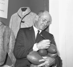 Tittle Prints: Star Football Player Autographing Footballs