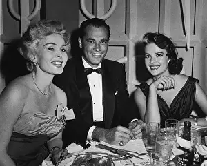Prints of 13th June 1957, Hungarian-born actor Zsa Zsa Gabor, hotel heir Conrad Nicky Hilton (926 - 1969), and American actor Natalie Wood (1938 - 1931) at Mike Romanoff's Restaurant Grace, Glamour & Timeless Elegance: Stars At Romanoffs