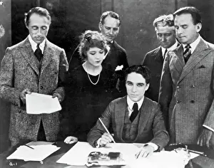 Prints of (L-R). Hollywood stars D.W. Griffith, Mary Pickford, Charlie Chaplin, and Douglas Fairbanks at a United Artists contract signing Master of Mime, Icon of Cinema: Chaplin in Prints: Stars Signing United Artists Contracts