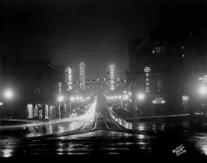 Prints of Night view looking down State Street from the intersection at North Carroll Street, Madison, Wisconsin, December 5, 1930 Celebrate the Season: A Curated Collection of Christmas Art: State Street Neon Signs at Night