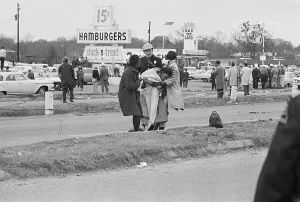 Selma Prints: State Trooper Watches Friends Aiding Unconscious Woman