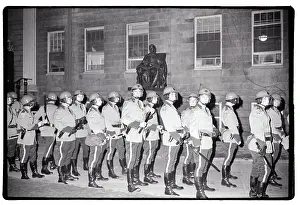 State Troops Lined Up in Front of Statue