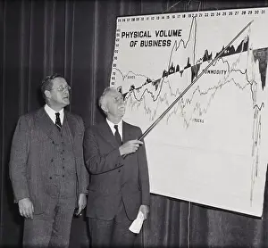 Statistician Roger Basson Pointing to Chart with Frank Smith