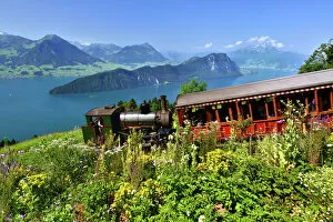 steam railway climbing Mount Rigi, Lake Lucerne, Burgenstock mountain and Pilatus mountain at the back, Vitznau