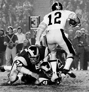 Steelers Quarterback Terry Bradshaw under pressure during Los Angeles Rams vs Pittsburgh Steelers 1975