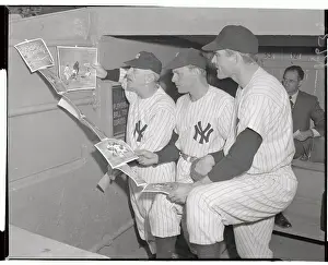 Stengel, Houk, and Mapes Looking Over Pictures
