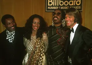 Prints of Performers George Benson, Donna Summer Stevie Wonder and Glen Campbell attend the Billboard Music Awards on December 11, 1977 in Santa Monica, California. Photo by Michael Ochs Archives/Getty Images) Visions of Wonder: Iconic Moments Captured: Stevie Wonder At The Billboard Music Awards
