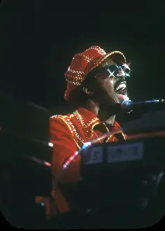 Prints of American musician Stevie Wonder performs onstage, November 1974. (Photo by Michael Ochs Archives/Getty Images) Visions of Wonder: Iconic Moments Captured: Stevie Wonder Performing in Red Hat