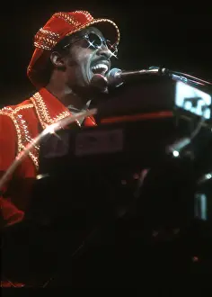 Prints of American musician Stevie Wonder performs onstage, November 1974. (Photo by Michael Ochs Archives/Getty Images) Visions of Wonder: Iconic Moments Captured: Stevie Wonder Performing in Red Hat