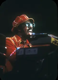 Prints of American musician Stevie Wonder performs onstage, November 1974. (Photo by Michael Ochs Archives/Getty Images) Visions of Wonder: Iconic Moments Captured: Stevie Wonder Performing in Red Hat
