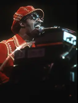 Prints of American musician Stevie Wonder performs onstage, November 1974. (Photo by Michael Ochs Archives/Getty Images) Visions of Wonder: Iconic Moments Captured: Stevie Wonder Performing in Red Hat