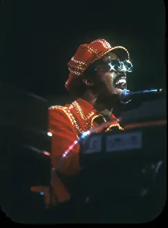 Prints of American musician Stevie Wonder performs onstage, November 1974. (Photo by Michael Ochs Archives/Getty Images) Visions of Wonder: Iconic Moments Captured: Stevie Wonder Performing in Red Hat