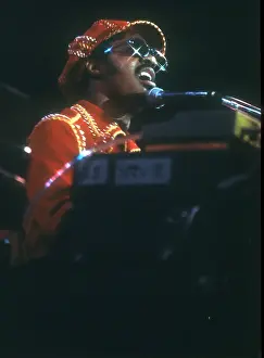 Prints of American musician Stevie Wonder performs onstage, November 1974. (Photo by Michael Ochs Archives/Getty Images) Visions of Wonder: Iconic Moments Captured: Stevie Wonder Performing in Red Hat