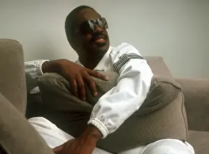 Prints of Musician Stevie Wonder poses for a portrait session on a couch wearing a white track suit at home in 1984. (Photo by Michael Ochs Archives/Getty Images) Visions of Wonder: Iconic Moments Captured: Stevie Wonder Portrait Session At Home
